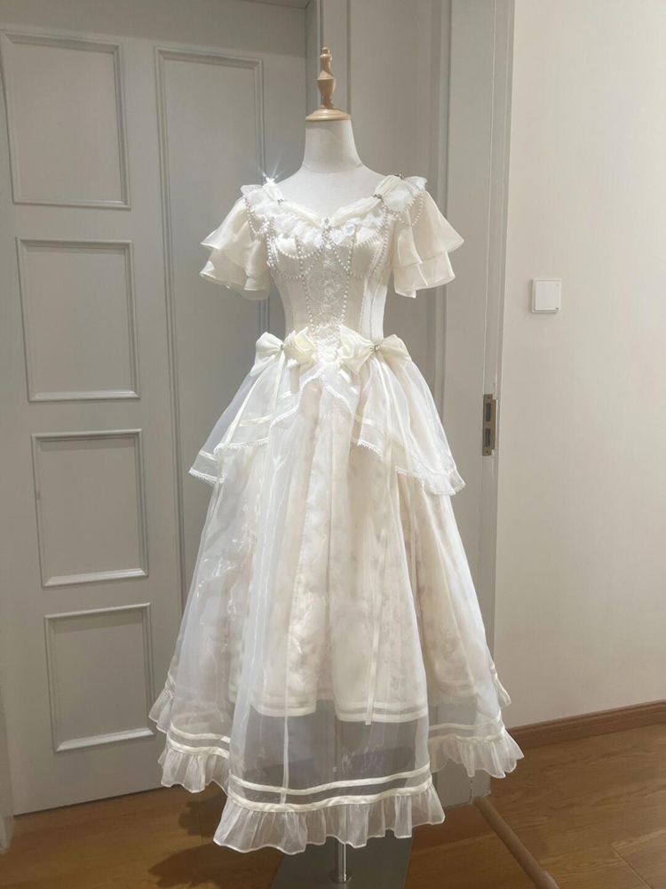 فستان بتصميم فيونكة عتيقة على  - مراجعة French Vintage Floral Midi Dress وسعره